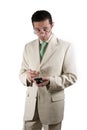 Businessman with PDA looking over his glasses Royalty Free Stock Photo