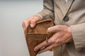 Businessman person holding an empty wallet, no money Royalty Free Stock Photo