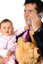 Businessman on phone with baby Royalty Free Stock Photo