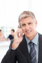 Businessman phoning while his team is working Royalty Free Stock Photo