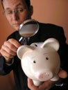 Businessman with a piggy bank Royalty Free Stock Photo