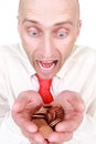 Businessman with pile of coins Royalty Free Stock Photo