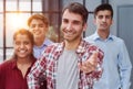 A businessman in a plaid shirt holds out his hand for a handshake. Royalty Free Stock Photo