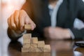 Businessman planing and strategy putting wooden blocks risk or success project Royalty Free Stock Photo