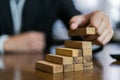 Businessman planing and strategy putting wooden blocks risk or success project Royalty Free Stock Photo