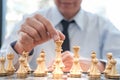 Businessman play with chess game. success management concept of business strategy and tactic challenge Royalty Free Stock Photo