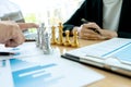 Businessman play chess on the marketing work place