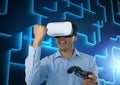 Businessman playing with computer game controller with blue maze background Royalty Free Stock Photo