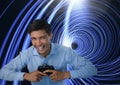 Businessman playing with computer game controller with bright tunnel background Royalty Free Stock Photo