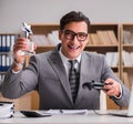 Businessman playing computer games at work office Royalty Free Stock Photo