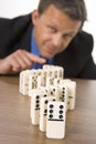 Businessman Playing Dominoes