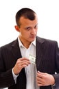 Businessman pocketing money