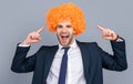 Businessman point finger on crazy wig. Business party. Business man at corporate party isolated on grey. Corporate fun Royalty Free Stock Photo