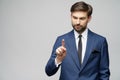 Businessman point finger at invisible screen, hand pushing touch screen, business man pressing digital virtual button Royalty Free Stock Photo