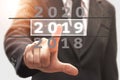 Businessman pointing calendar happy new year 2019. Royalty Free Stock Photo