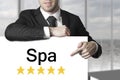 Businessman pointing on sign spa golden stars