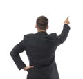 Businessman pointing at something on white background, back view Royalty Free Stock Photo