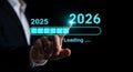 Transition to 2026 with loading progress bar and businessman pointing towards the future year Royalty Free Stock Photo