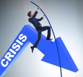 Businessman pole vaulting over crisis in business concept Royalty Free Stock Photo