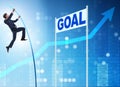 Businessman pole vaulting towards his goal in business concept Royalty Free Stock Photo