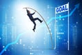 The businessman pole vaulting towards his goal in business concept Royalty Free Stock Photo