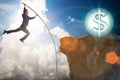 The businessman pole vaulting towards his money goal Royalty Free Stock Photo