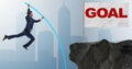 Businessman pole vaulting towards his success goal Royalty Free Stock Photo