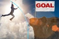 The businessman pole vaulting towards his success goal Royalty Free Stock Photo