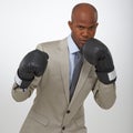 Businessman, portrait and boxing gloves for competition or corporate opportunity, rival or victory. Black man, face and