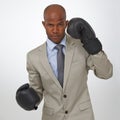 Businessman, portrait and boxing gloves for competition or corporate opportunity, rival or victory. Black man, face and