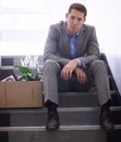 Businessman, portrait or job loss in company with box, stairs or thinking of career crisis. Salesman, sad and face for Royalty Free Stock Photo