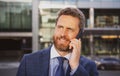 Businessman portrait. Man on smart phone. Casual urban professional business man using smartphone smiling happy Royalty Free Stock Photo