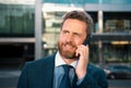 Businessman portrait. Man on smart phone. Casual urban professional business man using smartphone smiling happy Royalty Free Stock Photo