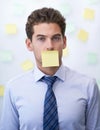 Businessman, portrait and sticky note on mouth or corporate schedule or to do list, project planning or censored. Male Royalty Free Stock Photo
