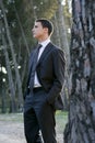 Businessman posing relaxed on a park forest Royalty Free Stock Photo