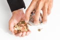 Businessman pouring coins fromn the glass to his hand, concept of saving  money for finance accounting, growing business Royalty Free Stock Photo