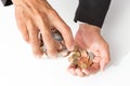 Businessman pouring coins fromn the glass to his hand, concept of saving  money for finance accounting, growing business Royalty Free Stock Photo