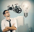 Businessman powering a big idea Royalty Free Stock Photo