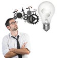 Businessman powering a big idea Royalty Free Stock Photo