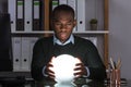 Businessman Predicting Future With Crystal Ball