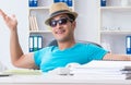 Businessman preparing for vacation in the office Royalty Free Stock Photo