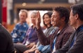 Businessman In Presentation At Conference Raising Hand To Ask Question Royalty Free Stock Photo