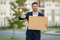 Businessman presenting signboard, billboard or banner. Business man with blank banner ad, posing outdoor. Portrait of Royalty Free Stock Photo