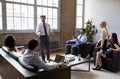 Businessman presenting to colleagues at an informal meeting Royalty Free Stock Photo