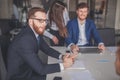 Businessman presenting to colleagues at a meeting Royalty Free Stock Photo