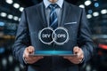 Businessman presents devops concept on tablet showcasing development and operations integration strategy Royalty Free Stock Photo