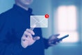 businessman press email screen for responding mail alert sign with blur holding smartphone. Royalty Free Stock Photo