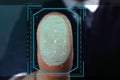 Businessman pressing control glass of biometric fingerprint scanner, closeup Royalty Free Stock Photo
