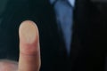 Businessman pressing control glass of biometric fingerprint scanner, closeup. Royalty Free Stock Photo