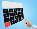 businessman pressing equal sign button on touch screen digital calculator interface on blue background